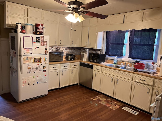 601 SW 9th Ave, Attalla, AL 35954 - kitchen with freestanding refrigerator, stainless steel dishwasher, visible vents, ceiling fan, and dark wood-style floors
