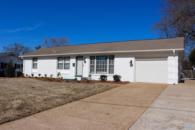 single story home with a garage and a front lawn