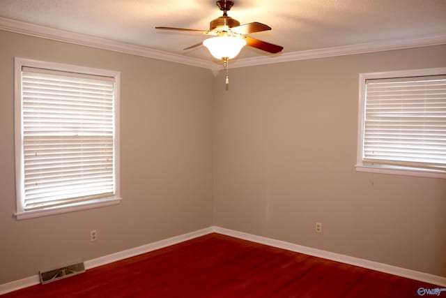 empty room with crown molding, hardwood / wood-style flooring, and ceiling fan