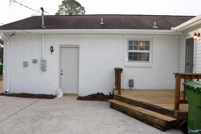 doorway to property with a wooden deck