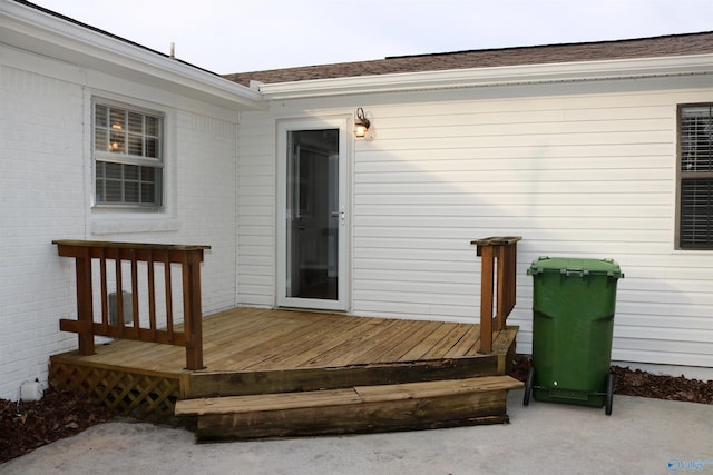 doorway to property with a wooden deck