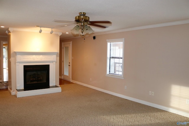 unfurnished living room featuring crown molding, carpet, and ceiling fan