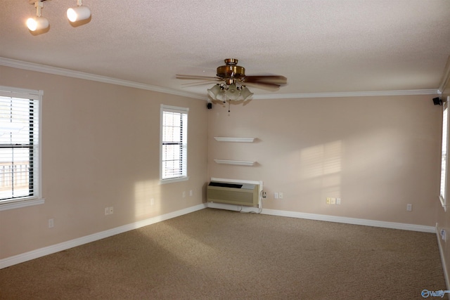 carpeted empty room featuring ceiling fan, crown molding, a textured ceiling, and a wall mounted AC