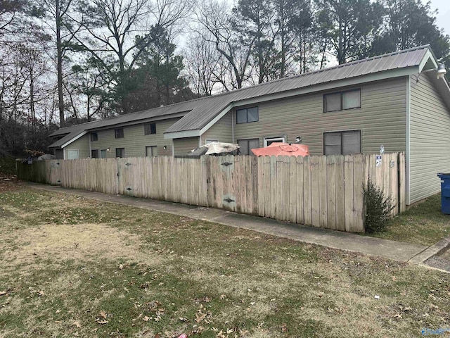 rear view of house with a yard