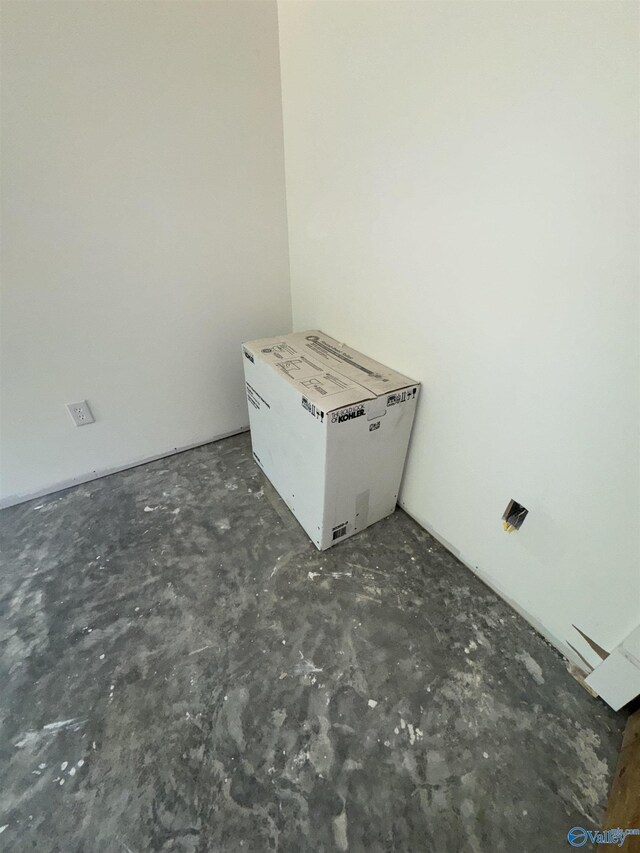 interior space with unfinished concrete floors