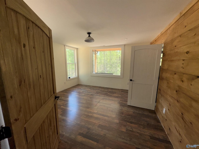 empty room with dark wood-style flooring