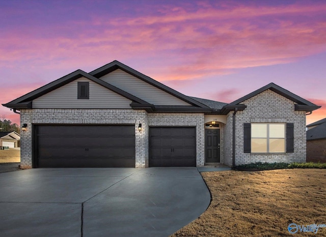 ranch-style home featuring a garage