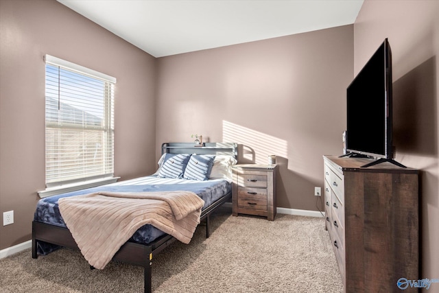 bedroom featuring light colored carpet