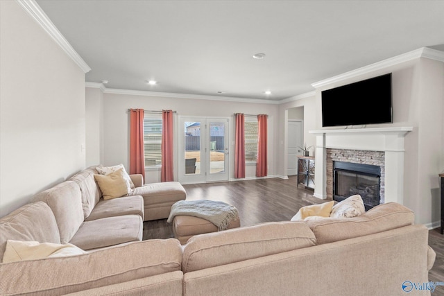 living room with a fireplace, ornamental molding, and dark hardwood / wood-style floors