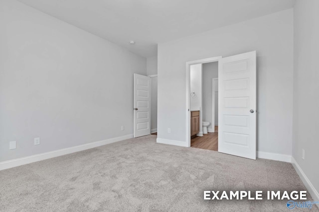 154 Heritage Lakes Blvd, New Market, AL 35761 - unfurnished bedroom featuring carpet floors, baseboards, and connected bathroom