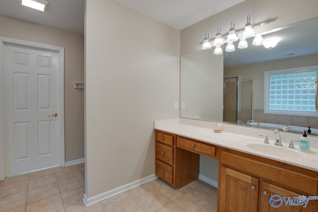 full bathroom featuring vanity, baseboards, tile patterned floors, and a shower stall