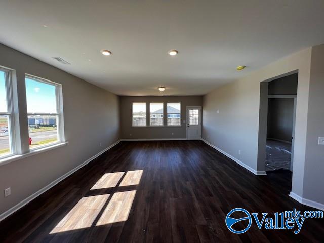 unfurnished room featuring dark hardwood / wood-style flooring