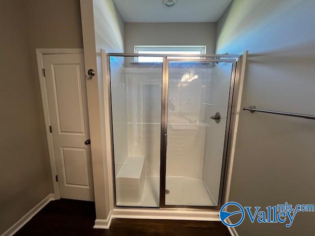 bathroom featuring an enclosed shower