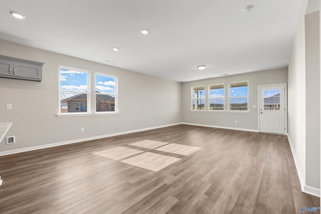 empty room featuring dark hardwood / wood-style flooring