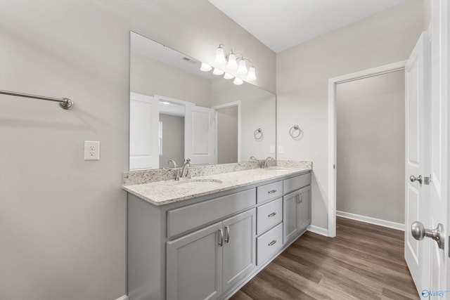 bathroom featuring vanity and hardwood / wood-style flooring