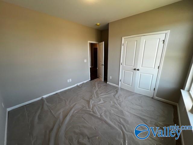 bedroom with carpet floors and a closet