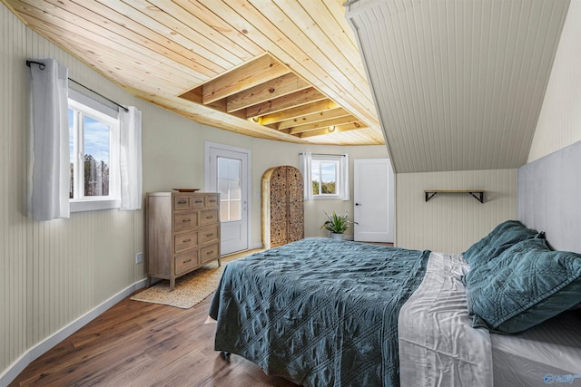 bedroom featuring wood ceiling, baseboards, lofted ceiling, and wood finished floors