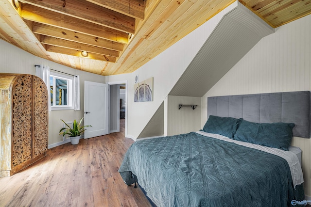bedroom with baseboards, wooden ceiling, and wood-type flooring