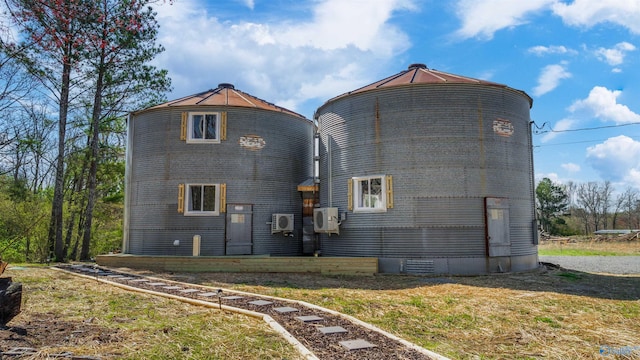 rear view of house with ac unit