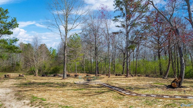 view of yard with a forest view