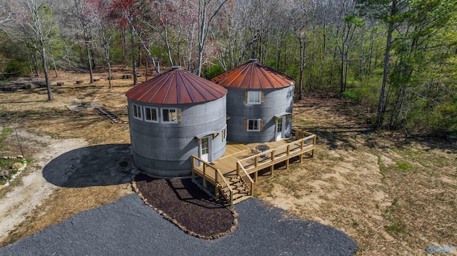 exterior space with a forest view