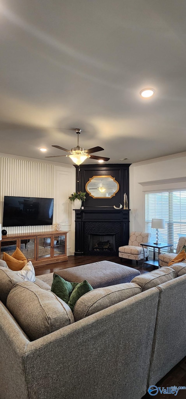 living room with ceiling fan, a fireplace, and recessed lighting