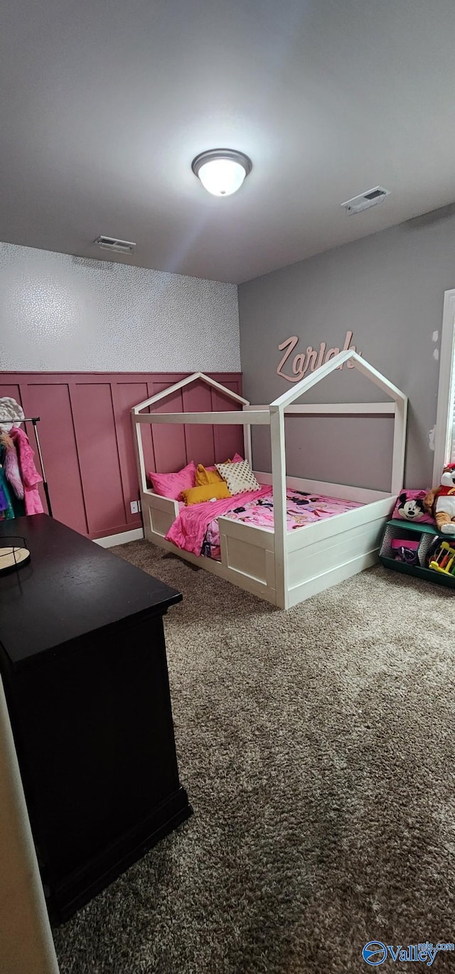 bedroom featuring carpet floors and visible vents