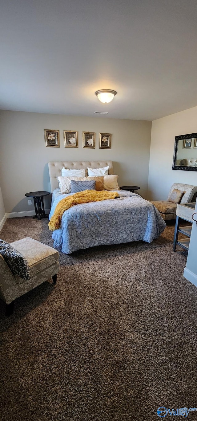 carpeted bedroom featuring visible vents and baseboards