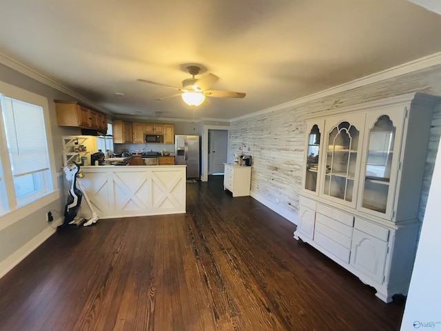 kitchen featuring dark wood-type flooring, crown molding, stainless steel fridge with ice dispenser, ceiling fan, and kitchen peninsula