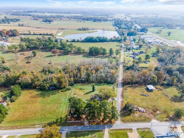 birds eye view of property with a rural view and a water view