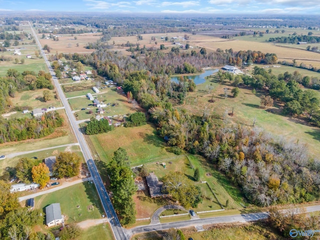 birds eye view of property with a water view and a rural view