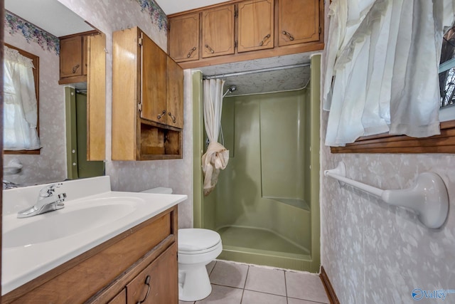 bathroom featuring toilet, a shower with curtain, vanity, and tile patterned flooring