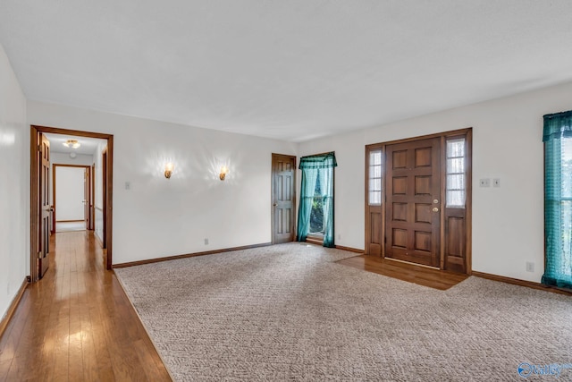 foyer featuring hardwood / wood-style flooring and a healthy amount of sunlight