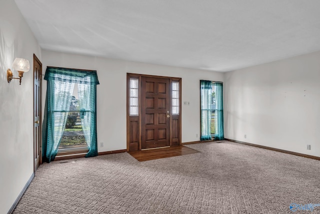 entrance foyer featuring carpet floors