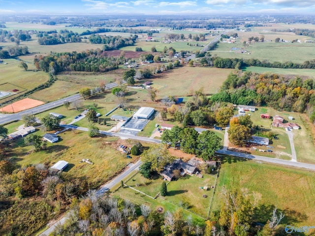 birds eye view of property with a rural view