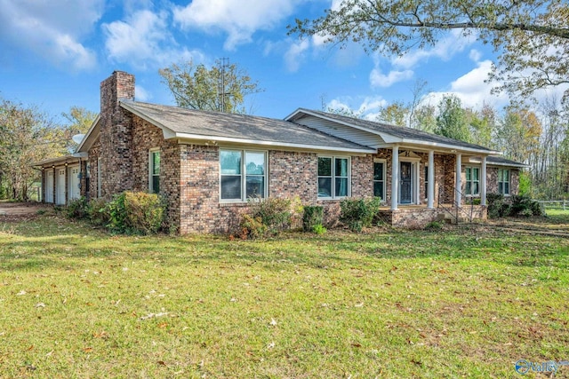 single story home featuring a garage and a front lawn