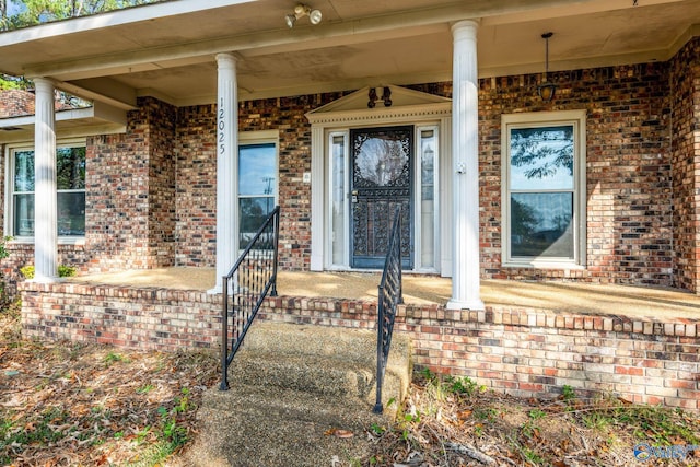 doorway to property featuring a porch