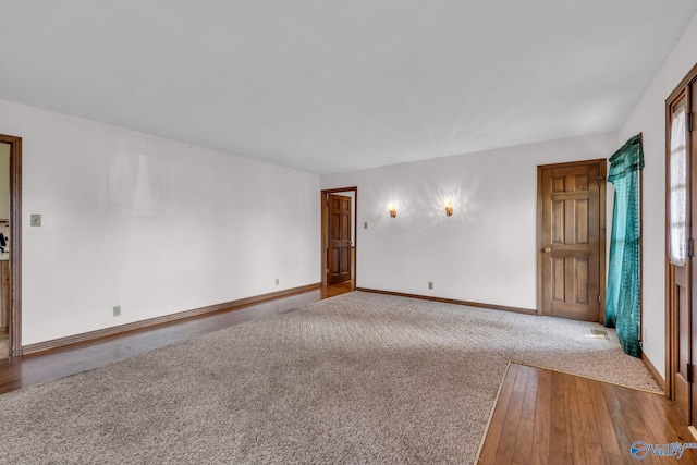 empty room with wood-type flooring