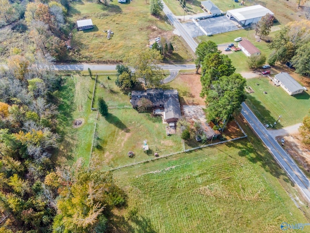 birds eye view of property featuring a rural view