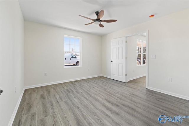 unfurnished bedroom featuring ceiling fan and light hardwood / wood-style flooring