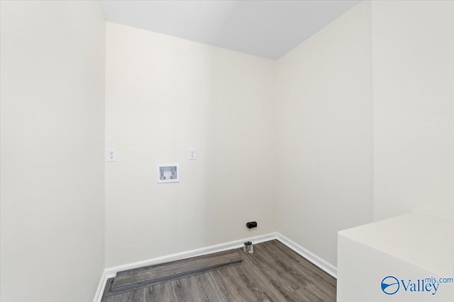 washroom with hardwood / wood-style floors and washer hookup