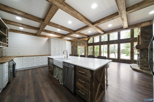 691 County Road 106, Leesburg, AL 35983 - kitchen with appliances with stainless steel finishes, butcher block countertops, dark wood-style flooring, white cabinetry, and open shelves