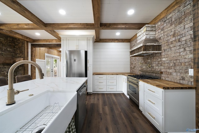 691 County Road 106, Leesburg, AL 35983 - kitchen featuring appliances with stainless steel finishes, wooden counters, dark wood finished floors, beamed ceiling, and white cabinetry