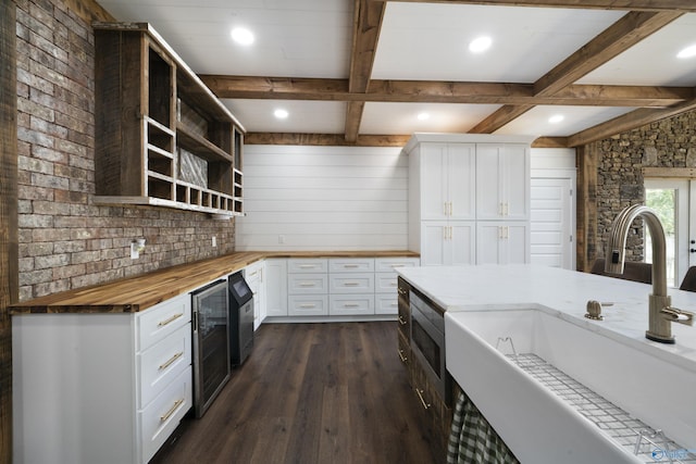 691 County Road 106, Leesburg, AL 35983 - kitchen featuring wooden counters, beverage cooler, open shelves, dark wood-style flooring, and beamed ceiling