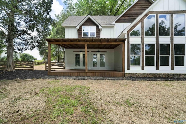 691 County Road 106, Leesburg, AL 35983 - back of property with french doors, ceiling fan, board and batten siding, a shingled roof, and a deck