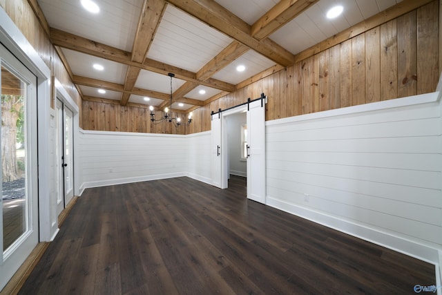 691 County Road 106, Leesburg, AL 35983 - empty room with a barn door, beam ceiling, dark wood finished floors, wood walls, and recessed lighting