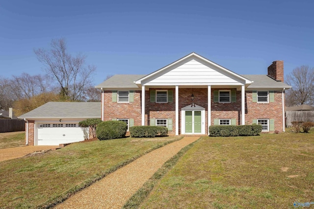 view of front of property featuring an attached garage, brick siding, fence, a front lawn, and a chimney