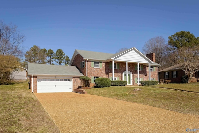 greek revival house with brick siding, a chimney, a garage, driveway, and a front lawn