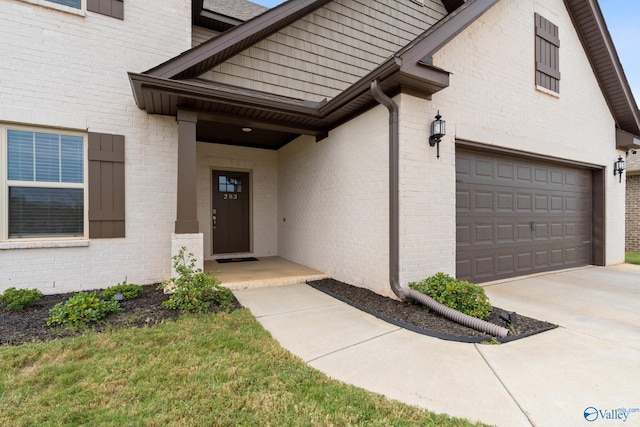 view of exterior entry with a garage