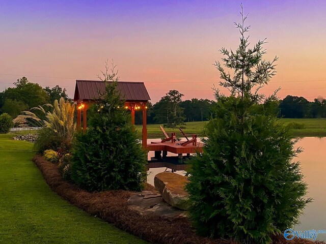 view of property's community with a gazebo and a yard